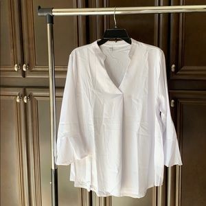 White blouse, bell sleeves. Brand new. Never worn